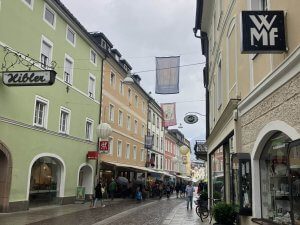 Bustling streets in Lienz town center lined with colorful storefronts and inviting cafes, perfect for family strolls. This is a key highlight among the 15 best things to do with kids in Lienz.