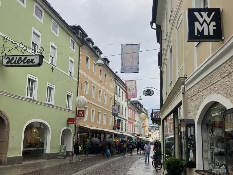 Bustling streets in Lienz town center lined with colorful storefronts and inviting cafes, perfect for family strolls. This is a key highlight among the 15 best things to do with kids in Lienz.
