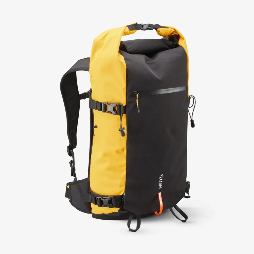 A durable yellow and black ski backpack with a roll-top closure, side compression straps, and a front zipper pocket marked “Wedze.” Great for carrying essentials on the slopes, making it a thoughtful ski gift.