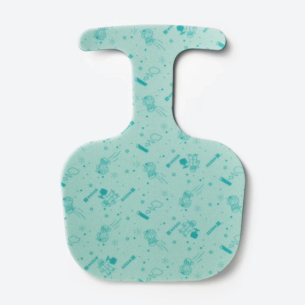 A teal foam bum slide sledge with playful winter-themed illustrations and a handle-shaped top. Lightweight and portable, it’s one of those fun ski gifts for breaks in the snow.